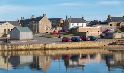 Fototapeta na wymiar 7 March 2023. Hopeman, Moray, Scotland. This is a scene from within the Harbour area of Hopeman with both its leisure and working small fishing boats.