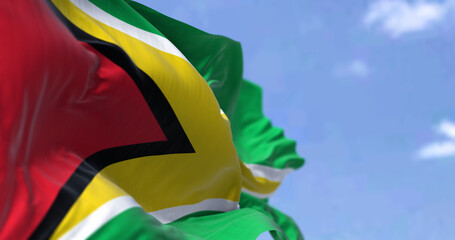 Detail of the national flag of Guyana waving in the wind on a clear day