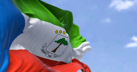 Detail of the national flag of Equatorial Guinea waving in the wind on a clear day