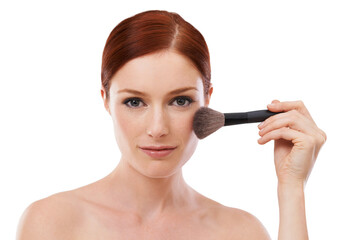Make up is my art. Beauty shot of a young woman holding a makeup brush against a white background.