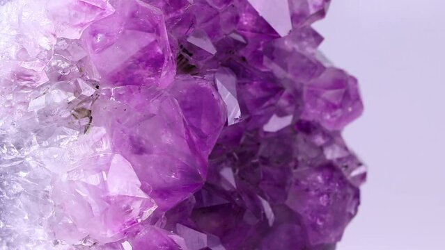 Purple amethyst isolated on a white background. Lilac Mineral amethyst. Violet Crystal stone