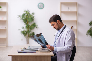 Young male doctor radiologist working in the clinic