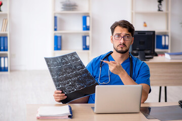 Young male doctor radiologist working in the clinic