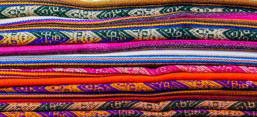 Lliclla - traditional woven blanket worn by women in the Peruvian Andes.
