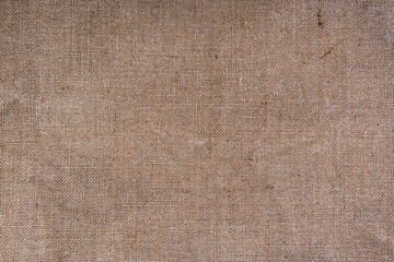 Fototapeta na wymiar Brown and Cream Canvas or rustic jute sackcloth woven fabric texture background. Textiles for coffee beans.