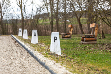 Focus on alphabetic points of an outdoor riding arena