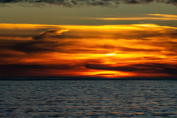 Obraz premium Surfing Rincon point on a big winter swell at sunset