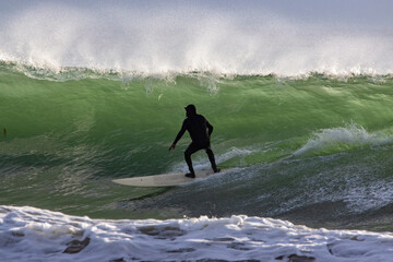 Surfing Rincon point on a big winter swell at sunset