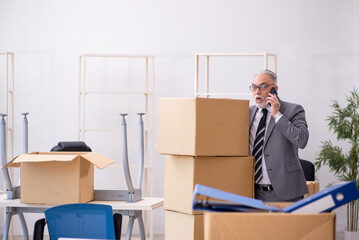 Old male employee in relocation concept