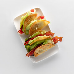 Delicious provolone crisps with bacon and lettuce, ready for eating.