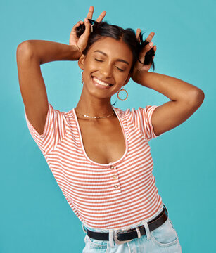 Always be your weirdest self. Shot of a young woman posing shot against a studio background.