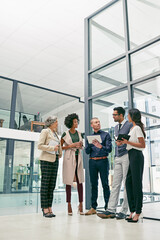Fototapeta premium Business is built on a solid foundation of relationships. Shot of a group of colleagues having an informal meeting in an office.