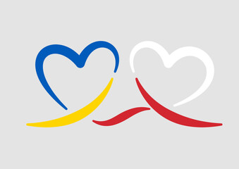 Polska pomoc Ukrainie. Łączące się serca w kolorach flag Polskiej i Ukraińskiej. Wsparcie dla Ukrainy. 
