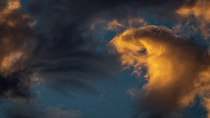 Naklejka na ściany i meble Blue Sky With Orange and White Clouds during sunset