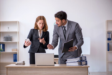 Two colleagues working in the office