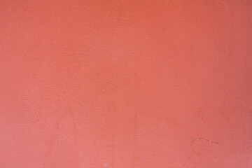 Background from a  pattern of pink stone wall covered with decorative plaster.