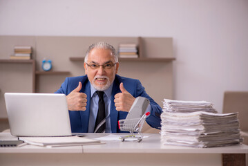 Old male boss working from home during pandemic