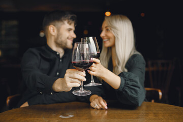 Romantic couple drinking wine at restaurant
