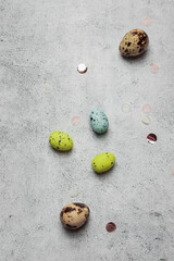 easter greeting card concept. set of varios pastel colorful egss on gray stone backround. Easter background. flatlay with copyspace