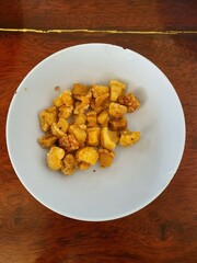Top view, close-up of crispy sliced ​​pork skin in a selectable focus cup.