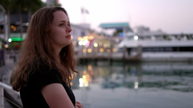 Young woman at Miami Bayside - close up shot in the evening - travel photography