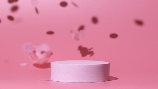 Cosmetics product mockup with confetti falling on pink background in slow motion
