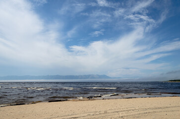 Beautiful sky in the clouds above Lake Baikal and the Svyatoy Nos Peninsula.