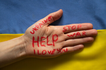 Female hand with text help, stop war, I love you, Ukraine on a white background, helping hand to peaceful Ukraine