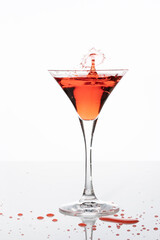 red cocktail with splash