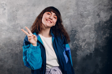 Young sporty woman 80 and 90's style. 90s fashion positive girl portrait.