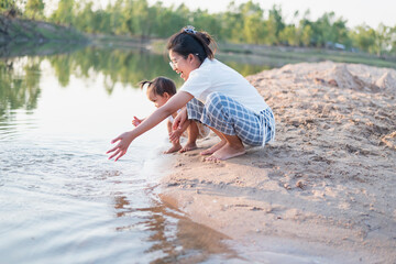 Portrait of happy loving mother and her baby outdoors.