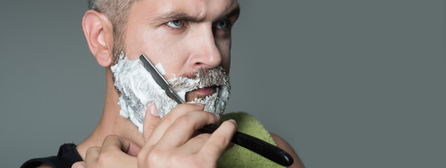 Bearded man shaving beard, beard gay. Barber with razor, barbershop. Shaving in barber shop. Mustache men. Shaving cream, foam. Templates web banner design. Horizontal banner for website header.