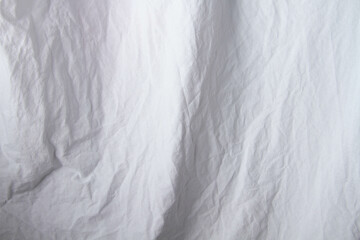 Texture of white fabric. White background close up. Factory fabric in white.
