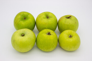 Few green apples on white background