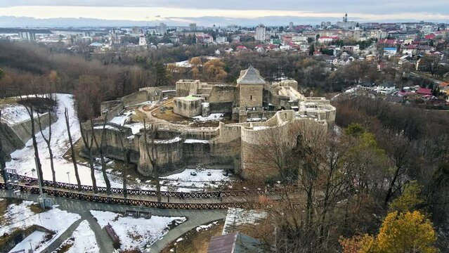 Aerial drone view of The Seat Fortress in Suceava in winter, Romania. Medieval fortress, bare trees, snow