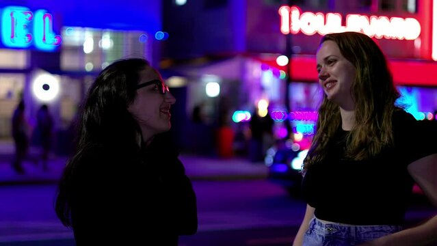 Two girls at Miami Beach at night - the colorful Ocean Drive of South Beach - travel photography