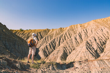 Man against badlands in a Crimea