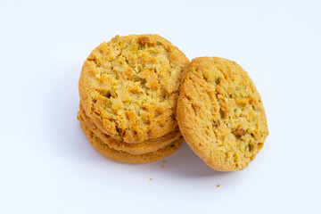 Pistachio and almond cookies on white background.