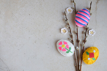 Bouquet of willow twigs and handmade easter eggs from felt. Childrens DIY concept. Easter decoration