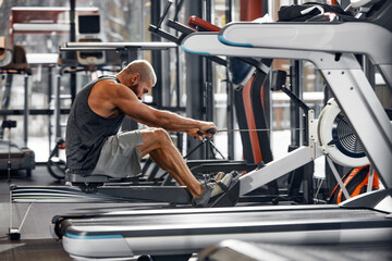 Training legs in the simulator, the athlete works with his legs on the simulator, working out the...