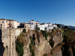 Naklejka premium Amazing village of Ronda. White villages in the province of Malaga, Andalusia, Spain. Beautiful village on the cliff of the mountain. Touristic destination. Holidays and enjoy the sun. 