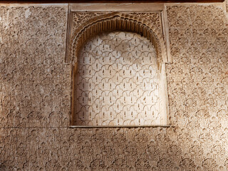 Close up detail of filigree walls, arches. Detailed handcraft of Moorish Architecture. Travel in time and discover history. Historic destination. Beautiful background and textures. 
