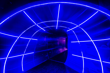 Blue illuminated light hole funnel concept of time traveling.