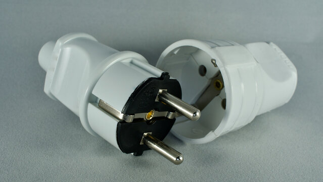 male and female power plug. Wireless plug end. Grounded plug.