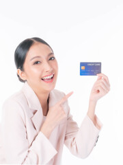 Business Asian woman showing and pointing credit card for payment shopping online isolated on white background , paying by credit card online shopping  e-commerce telemarketing concept