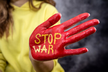 russia international terrorist. stop war red paint at female hands