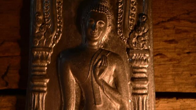 candle light with buddha statue at temple