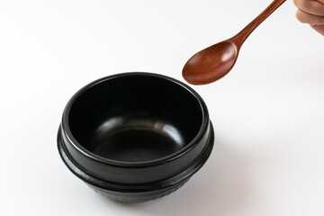 Clay pot and tableware on a white background
