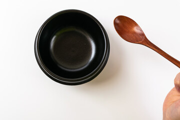 Clay pot and tableware on a white background