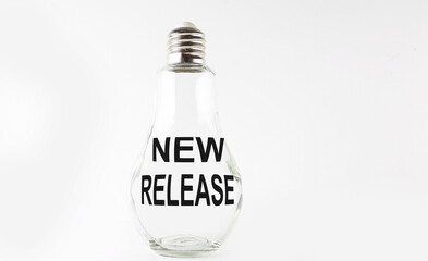 Text NEW RELEASE on the bulb on the white background. Business concept